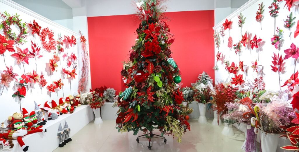 Imagine the wow factor of lush green tree branches adorned with twinkling lights and radiant red poinsettias. 